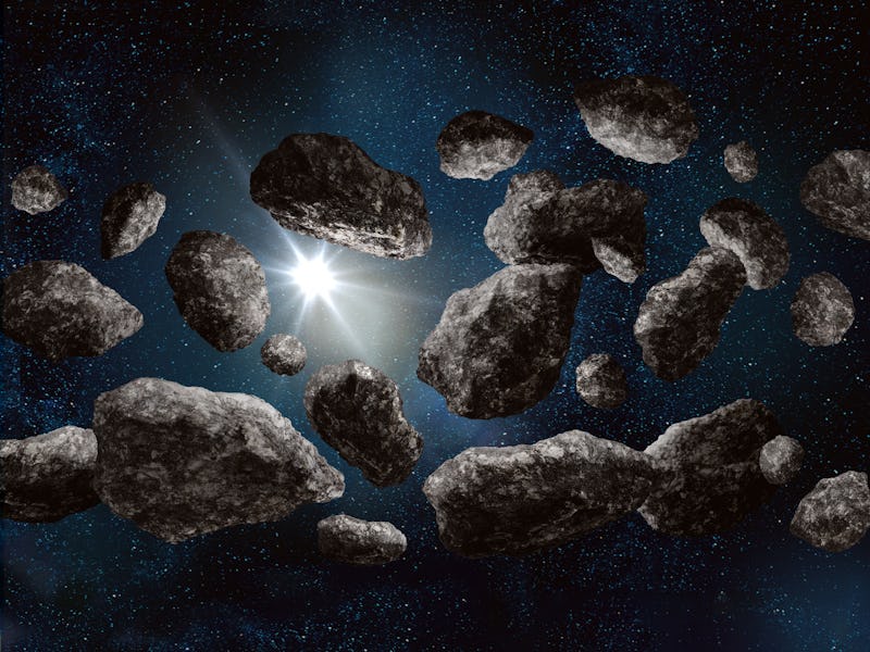 Inside asteroid belt in deep space on starfield background