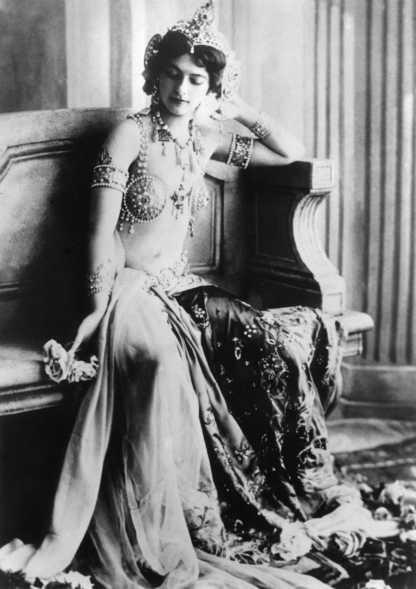 Mata Hari wears her bra top costume in a portrait. 