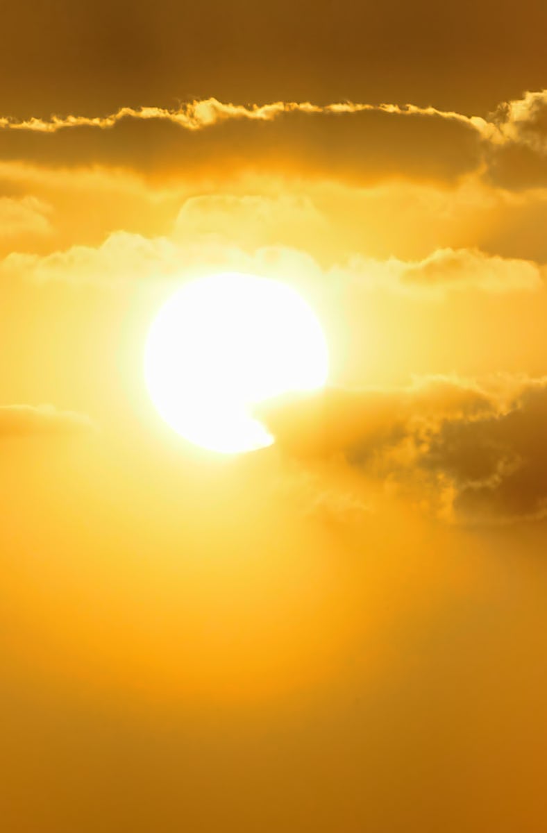 A superb image of the sunlight and the clouds, both floating in the morning sky.