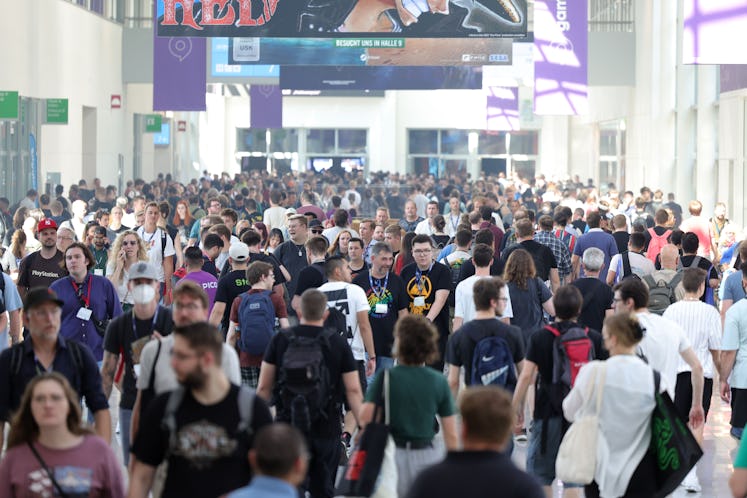 COLOGNE, GERMANY - AUGUST 24: Visitors walk past during the press day at the 2022 Gamescom gaming tr...