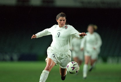Mia Hamm runs to control the ball during the game against Team Canada for the First Pacific Cup at t...