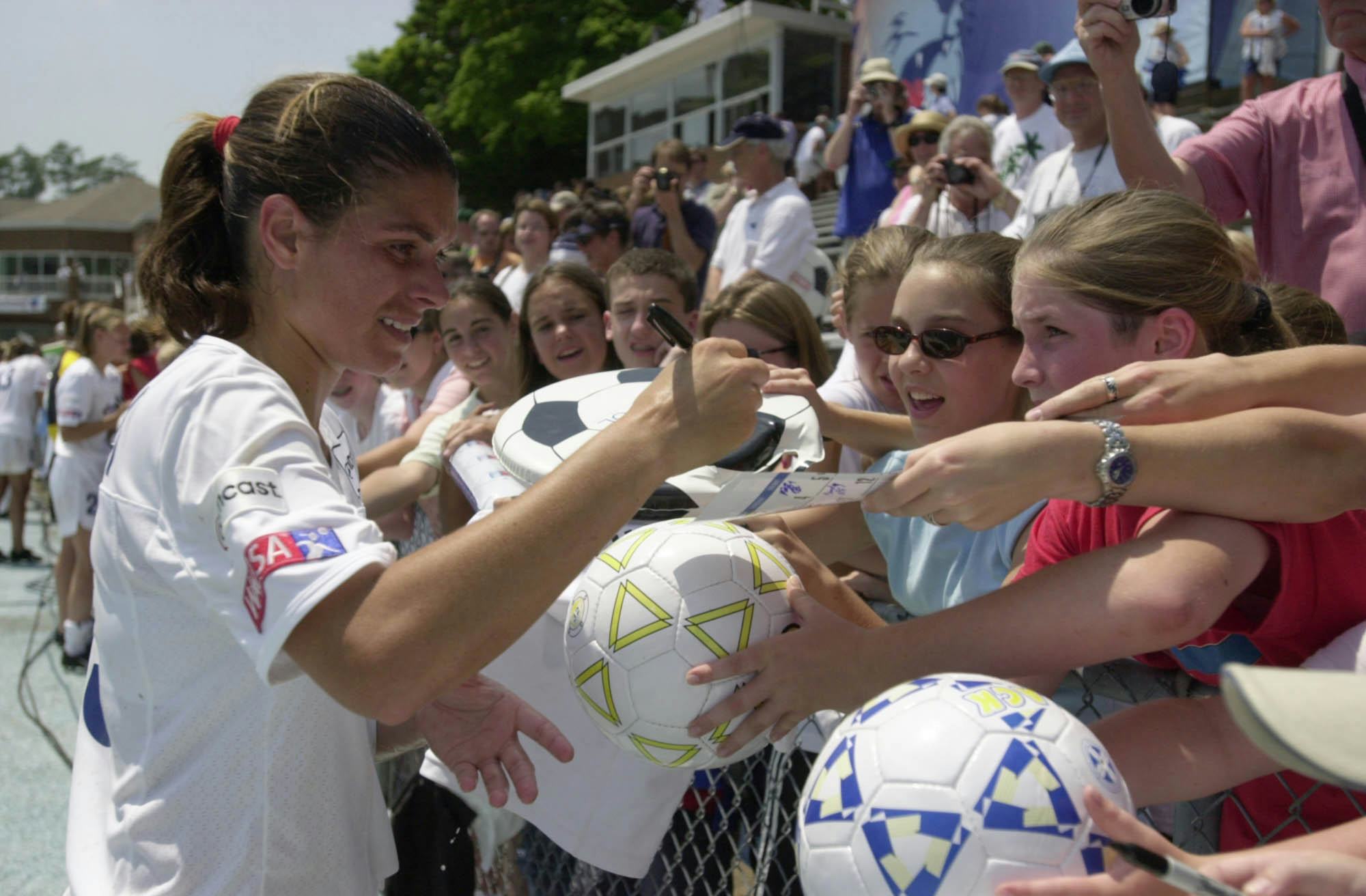 Mia Hamm #19 of the Washington Freedom signs autographs before a game against the Carolina Courage a&hellip;