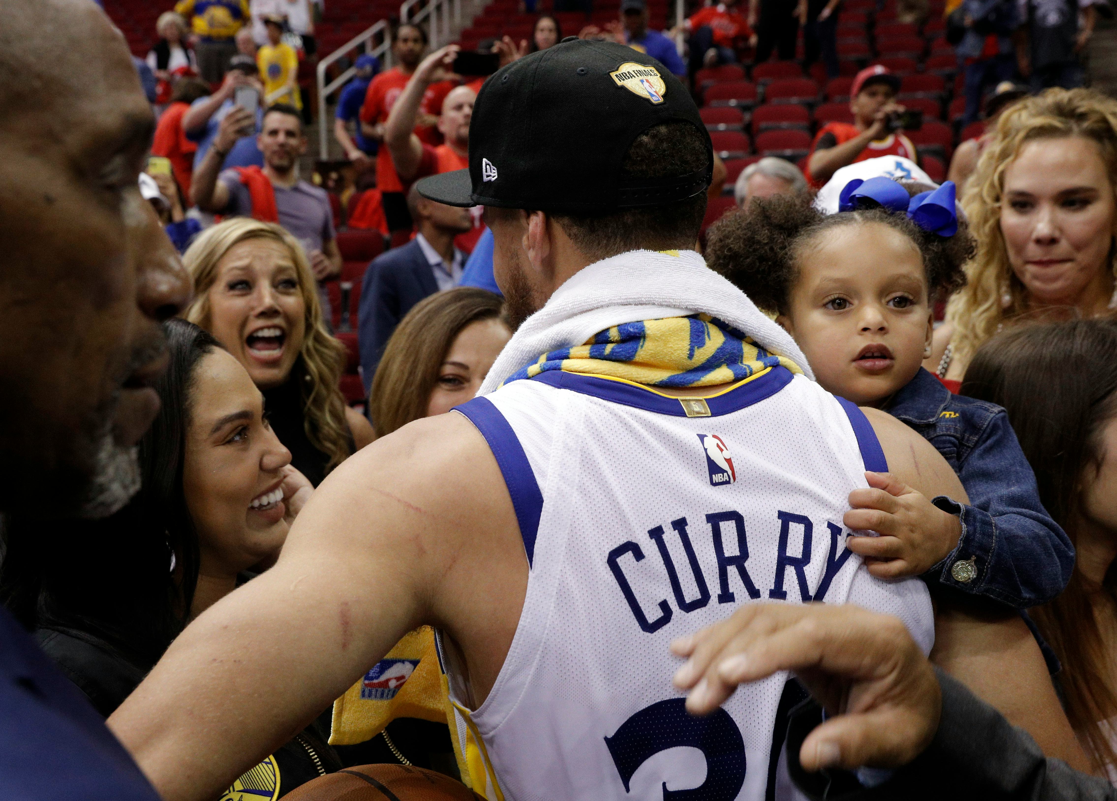 Stephen Curry rushes over to his wife Ayesha and mother Sonya Curry after the Golden State Warriors ...