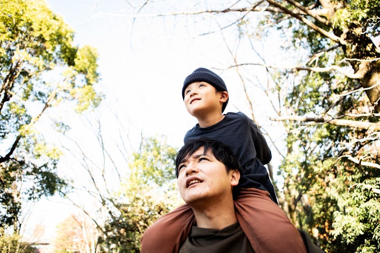 In the park in autumn. November in Japan. 2 year old boy, father in his 30s.