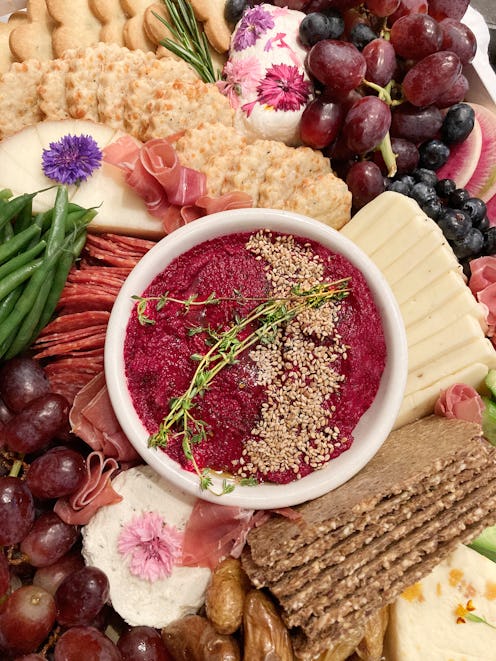 Charcuterie Grazing Board with Sausage, Salami, Cheese and Beet Hummus. (Photo by: GHI-Plexi/UCG/Uni...