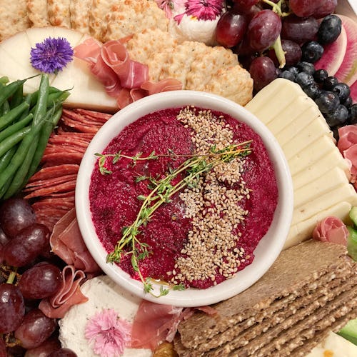 Charcuterie Grazing Board with Sausage, Salami, Cheese and Beet Hummus. (Photo by: GHI-Plexi/UCG/Uni…