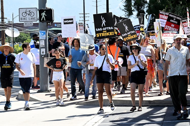 BURBANK, CALIFORNIA - AUGUST 02: Members Of SAG-AFTRA And WGA walk the picket line during the strike...