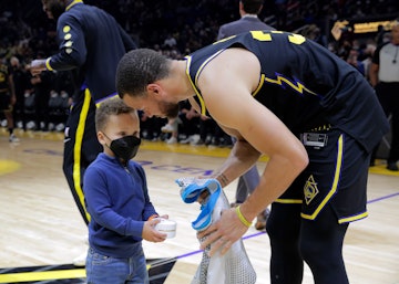SAN FRANCISCO, CA - FEBRUARY 16:Stephen Curry (30), is presented with a commemorative ring in a surp...
