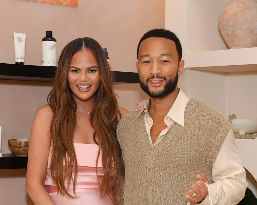 LOS ANGELES, CALIFORNIA - JULY 20: (L-R) Chrissy Teigen and John Legend attend LOVED01 By John Legen...