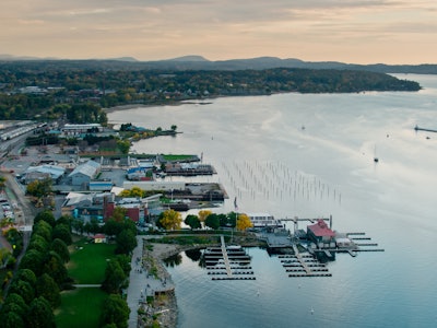 Aerial shot of Burlington, Vermont at sunset on a Fall evening, from over the water of  Lake Champla...