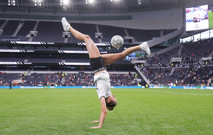 LONDON, ENGLAND - FEBRUARY 12: Football freestyler Lia Lewis performs at half time during the FA Wom...