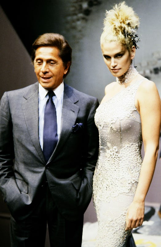 Model Cindy Crawford and designer Valentino Garavani walk the runway at the finale of the Valentino ...
