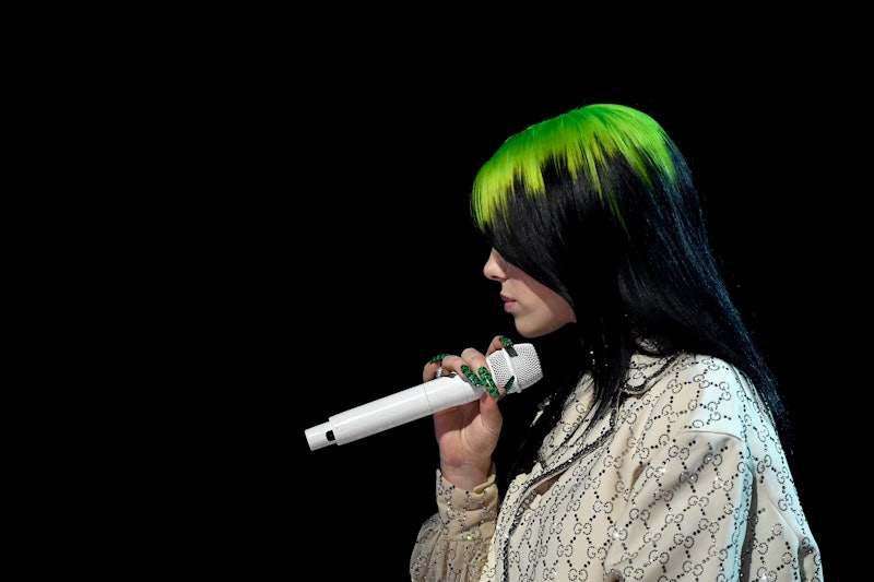 Billie Eilish's black & green hair was her OG look. Her new hair has fiery red roots.