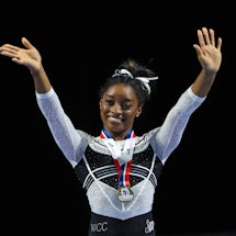 HOFFMAN ESTATES, ILLINOIS - AUGUST 05: Simone Biles celebrates after winning the all-around at the C...