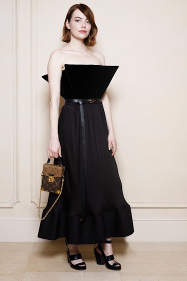 Emma Stone poses during a portrait session as she attends a Louis Vuitton private dinner at the Hote...