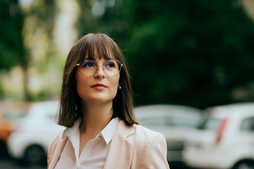 young woman going to work, city street
