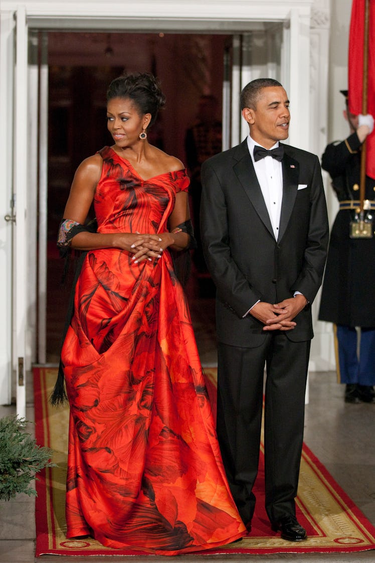 President Barack Obama and first lady Michelle Obama wait to greet Chinese President Hu Jintao for a...