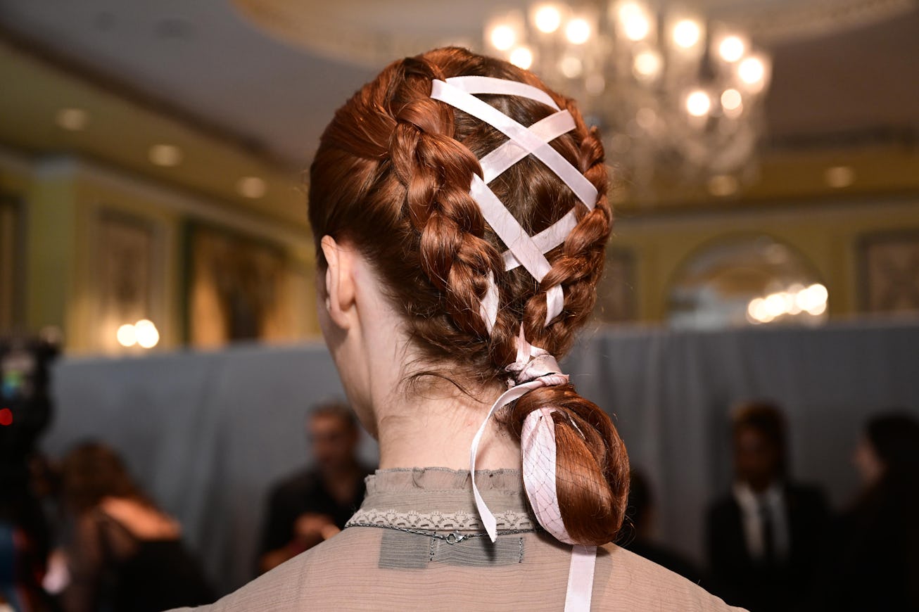 NEW YORK, NEW YORK - SEPTEMBER 08: A model prepares backstage during TRESemme X Christian Siriano du...