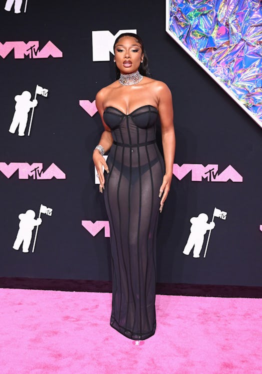 Megan Thee Stallion wears a sheer bustier dress and exposes her thong at the 2023 MTV Video Music Aw...