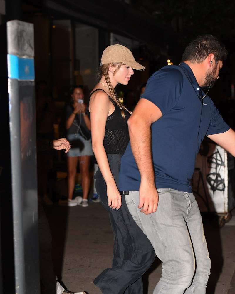 Taylor Swift pigtail braids and baseball hat 2023