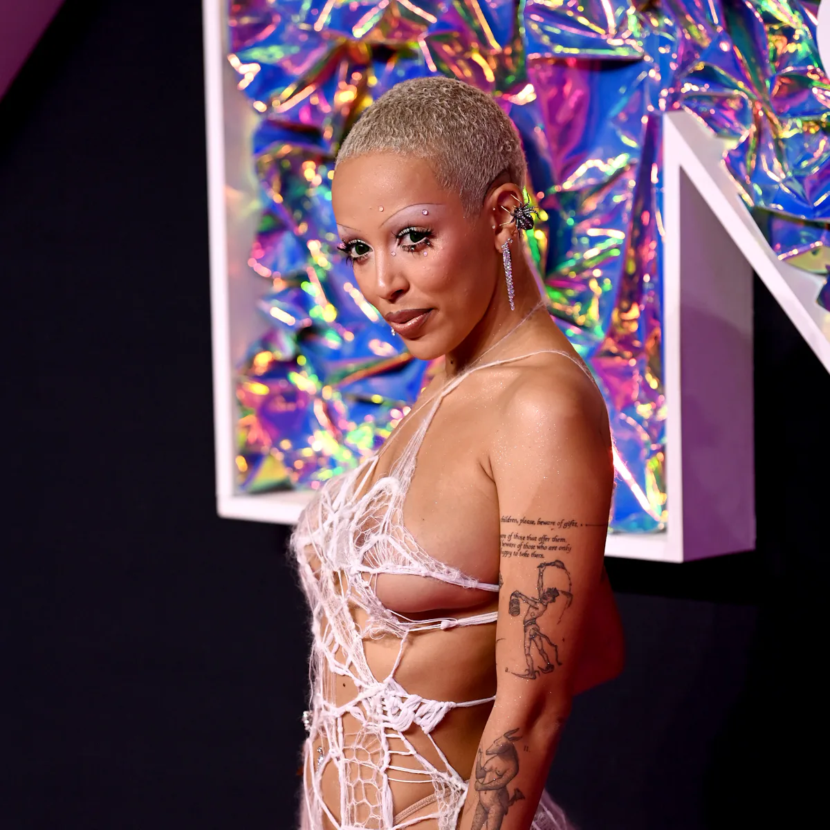 doja cat knit dress Doja Cat sizzles in sheer spiderweb dress on VMAs 2023 red carpet