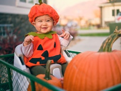 a baby in a costume in an article about can babies go trick or treating?