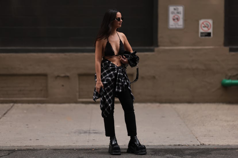 NEW YORK, NEW YORK - SEPTEMBER 09: Guest is seen outside Tibi show wearing black MiuMiu sunnies, bla...