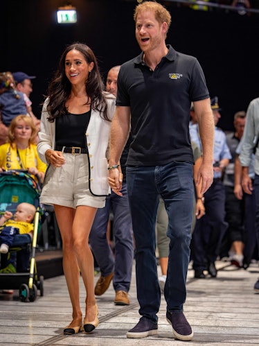 Britain's Meghan, Duchess of Sussex and Britain's Prince Harry, Duke of Sussex, arrive at the 2023 I...