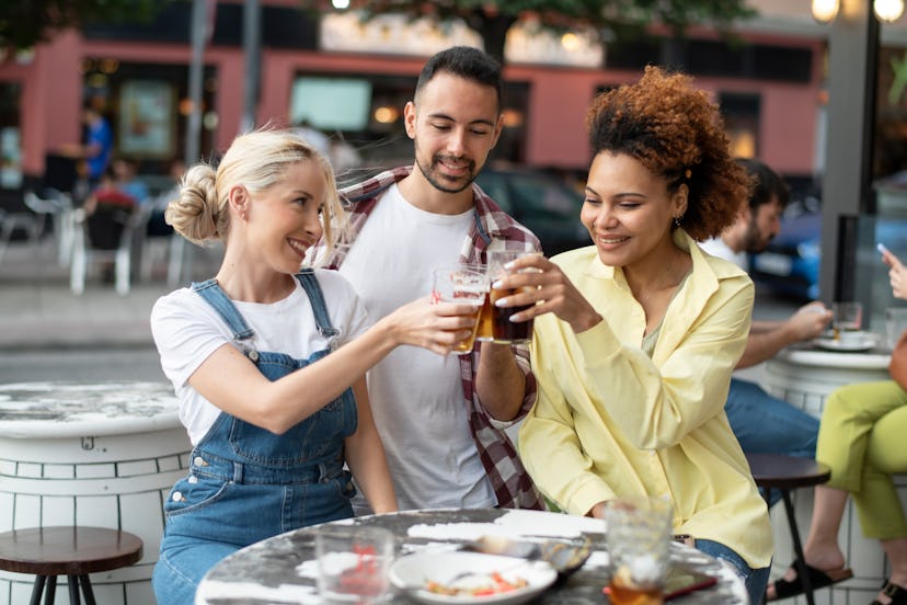 Group of friends having fun in bar terrace outdoors