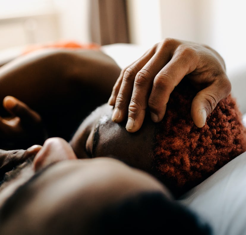 couple lying in bed after trying kinks based on their zodiac sign