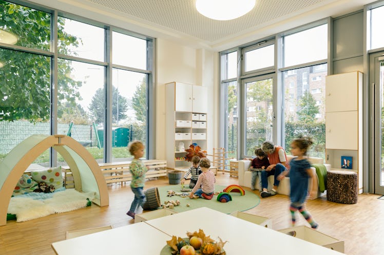 Children running around and playing at daycare.