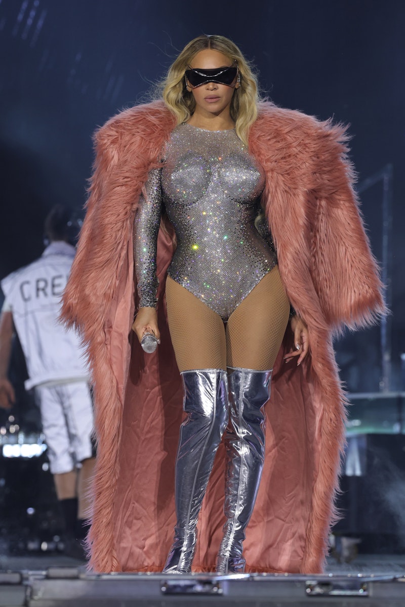 Beyoncé performs onstage during the "RENAISSANCE WORLD TOUR" wearing a cone bra silver bodysuit, met...