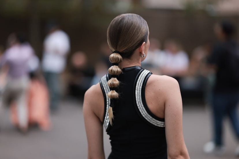 Interesting ponytails are a London Fashion Week Spring/Summer 2024 street style beauty trend