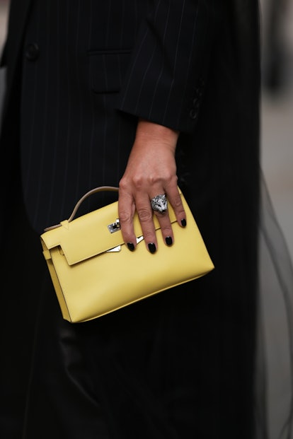 Short nails and solid colors  are a London Fashion Week Spring/Summer 2024 street style beauty trend