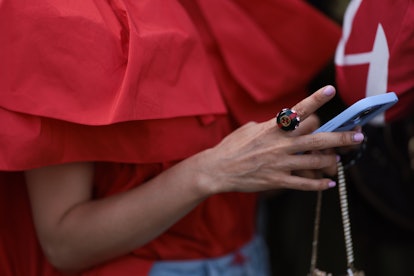 Short nails and solid colors  are a London Fashion Week Spring/Summer 2024 street style beauty trend