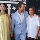 Matthew McConaughey is pictured with his wife, Camila Alves, and son on a red carpet