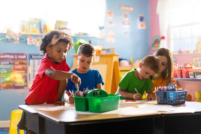 Childern learning and growing with their teacher in a daycare environment