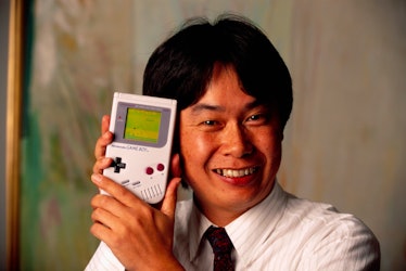 Shigeru Miyamoto, creator of Mario and other characters and video games for Nintendo, holds a Ninten...