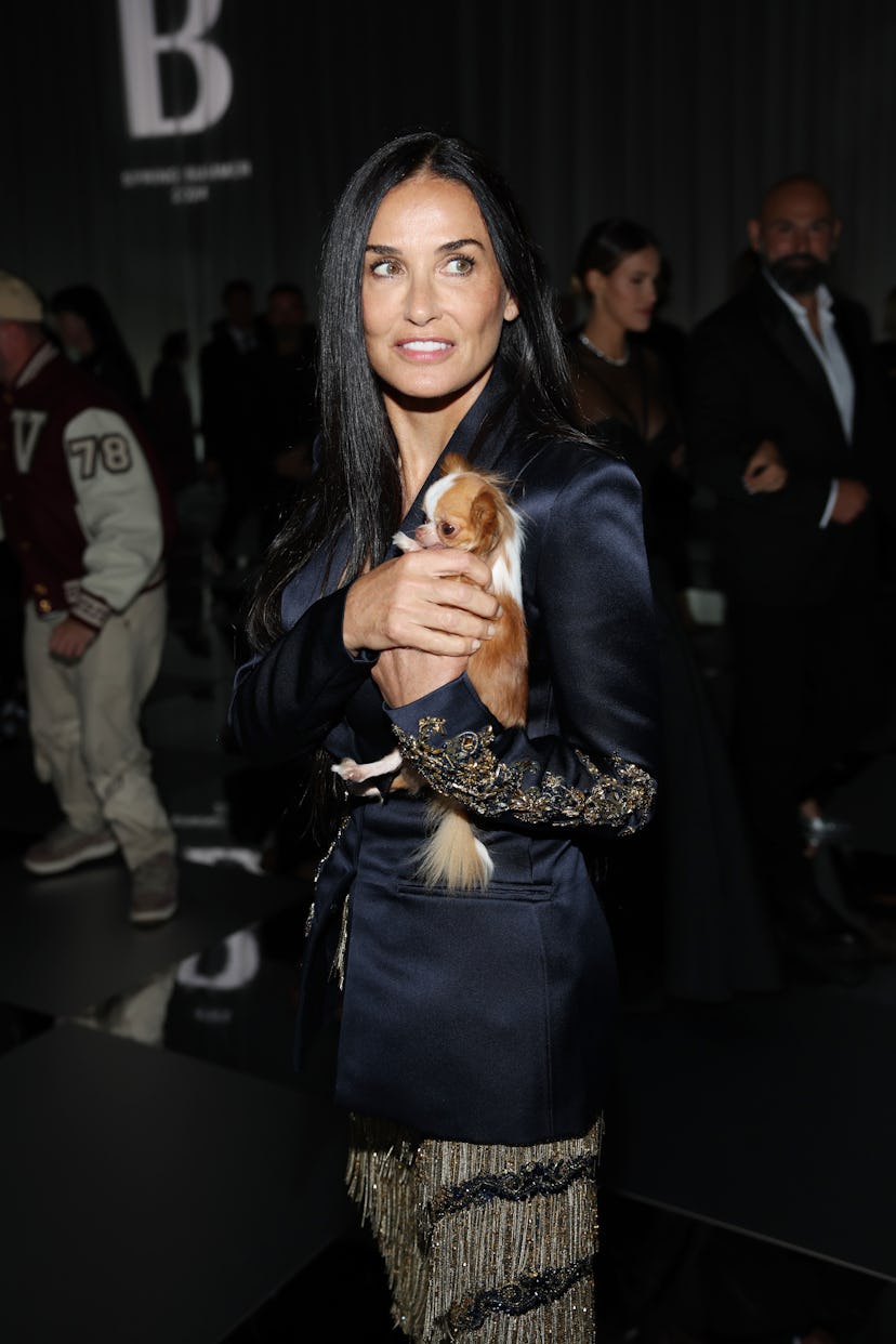 Demi Moore attends the Versace fashion show during the Milan Fashion Week Womenswear Spring/Summer 2...