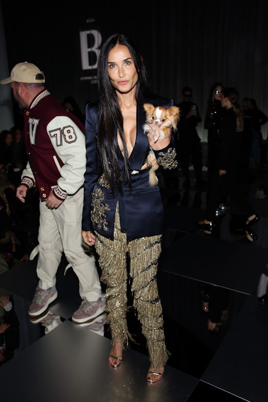 Demi Moore attends the Versace fashion show during the Milan Fashion Week Womenswear Spring/Summer 2...