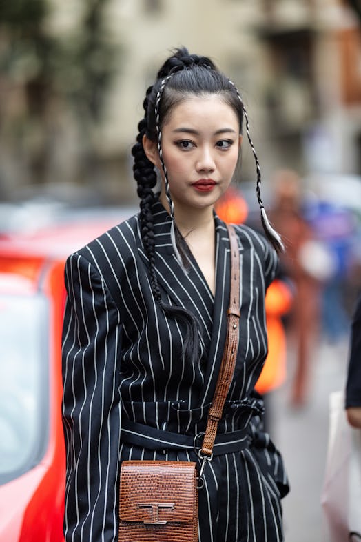 Braided ponytails are a Milan Fashion Week Spring/Summer 2024 street style beauty trend