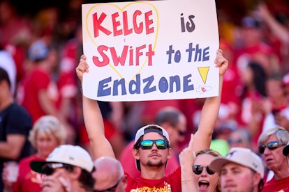 A fan holds a sign supporting Taylor Swift and Travis Kelce 