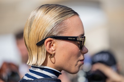 Slicked-back short cuts are a Paris Fashion Week Spring/Summer 2024 street style beauty trend