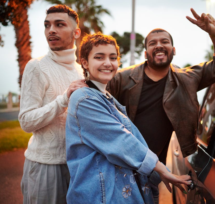 a young group of friends poses for a selfie before getting in the car, as they discuss the reason th...