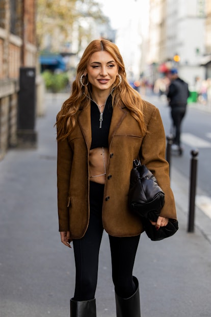 Copper penny hair is a Paris Fashion Week Spring/Summer 2024 street style beauty trend