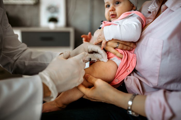 Baby getting a shot in her leg at the doctor's office, in a story about why it's so hard to find Cov...