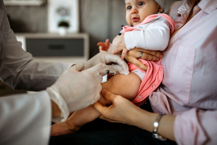 Baby getting a shot in her leg at the doctor's office, in a story about why it's so hard to find Cov...