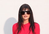 kylie jenner wears a red dress to acne's paris fashion week show in september 2023