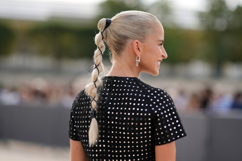 Braided ponytails are a Paris Fashion Week Spring/Summer 2024 street style beauty trend