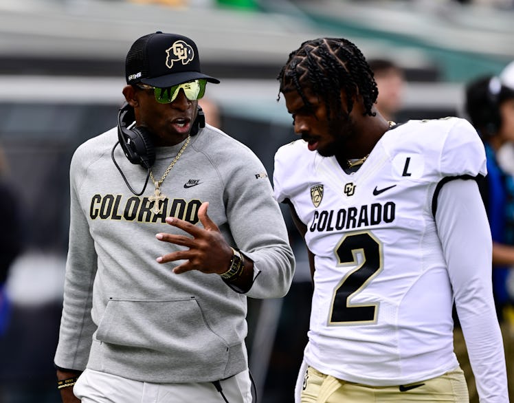 EUGENE, OR - SEPTEMBER 23: Colorado Buffaloes head coach Deion Sanders talks with his son Colorado B...